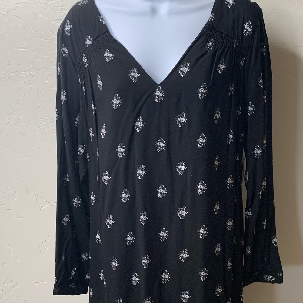 Black v cut dress with white flowers